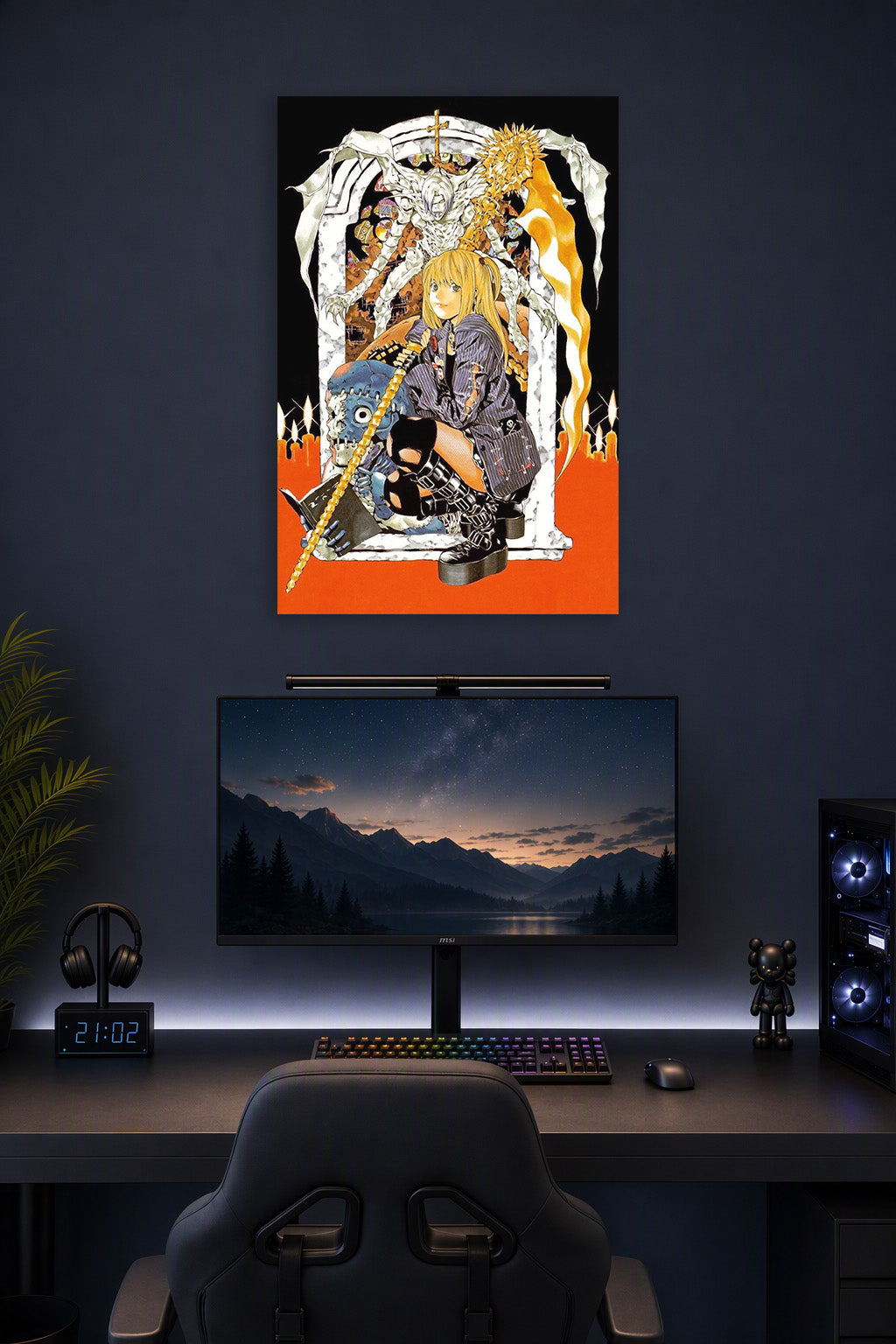 Misa Amane Death Note in a gaming desk setup above a monitor.