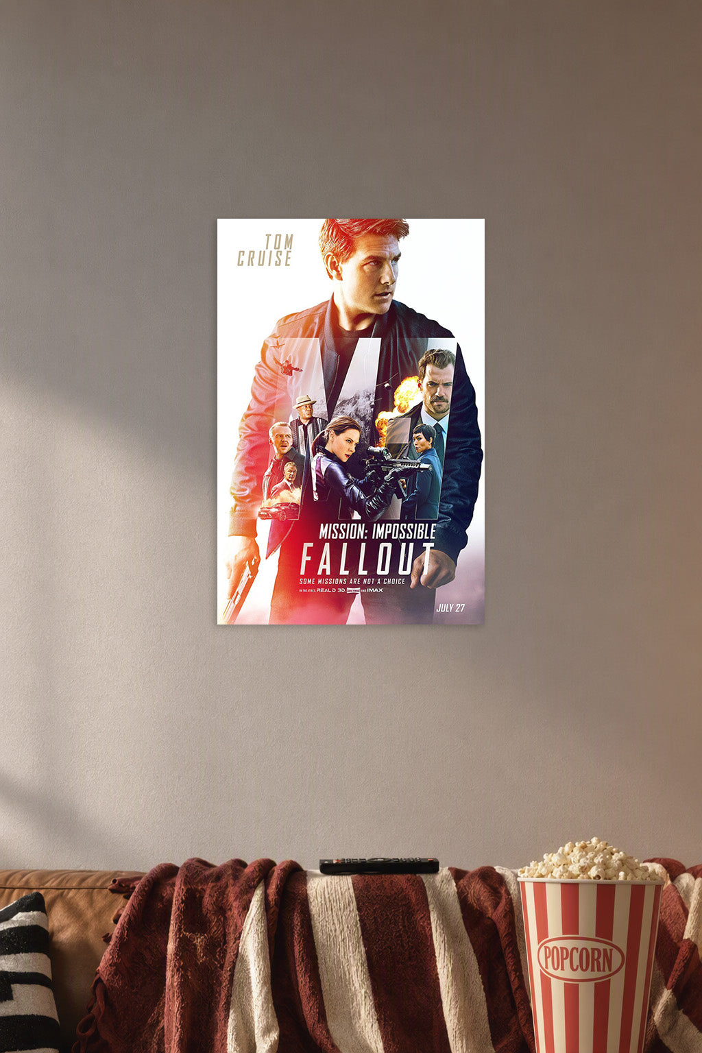 Mission: Impossible - Fallout Movie Poster in a cozy movie room above a brown sofa with popcorn.