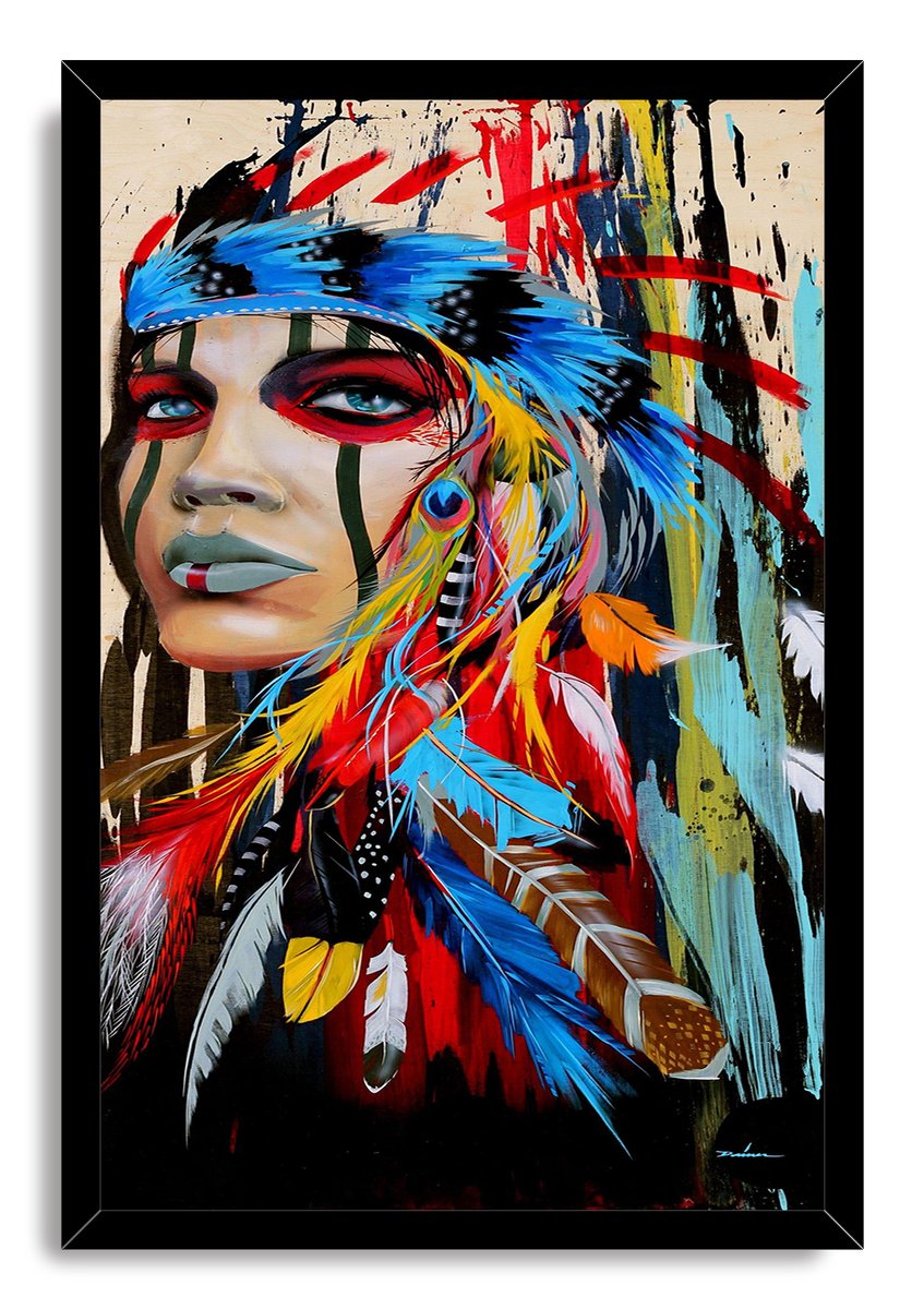 Framed modern tribal woman wall art print with intense blue eyes, green facial markings, colorful feathers, and abstract paint strokes.