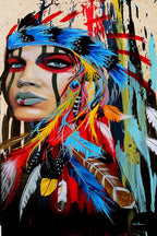 Modern tribal woman wall art print with blue eyes, facial stripes, and a vivid blue, red, yellow, and white feather headdress.