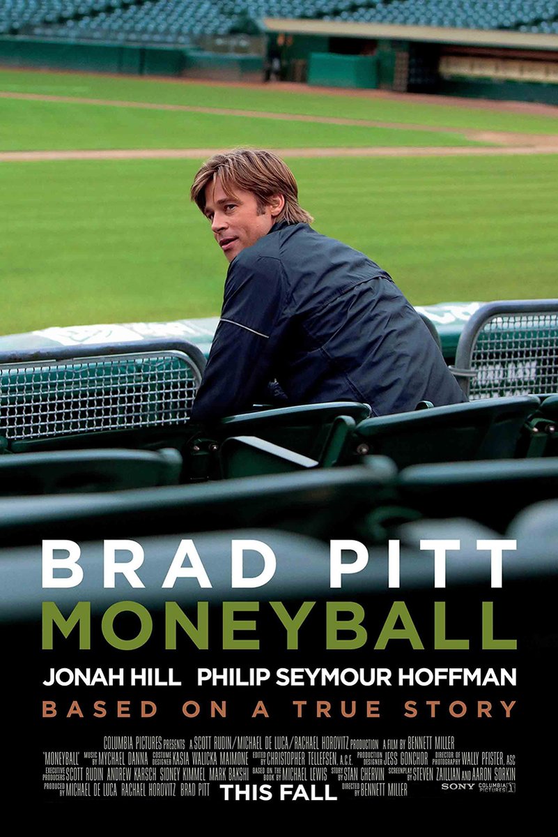 Moneyball movie poster features Brad Pitt seated in green baseball stadium seats, with bold white and olive title text.