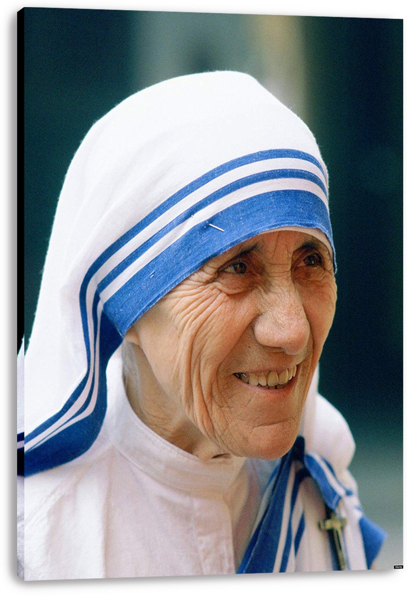 Mother Teresa canvas wall art print featuring her warm smile and white-and-blue striped headscarf, displayed with visible wrapped edges.
