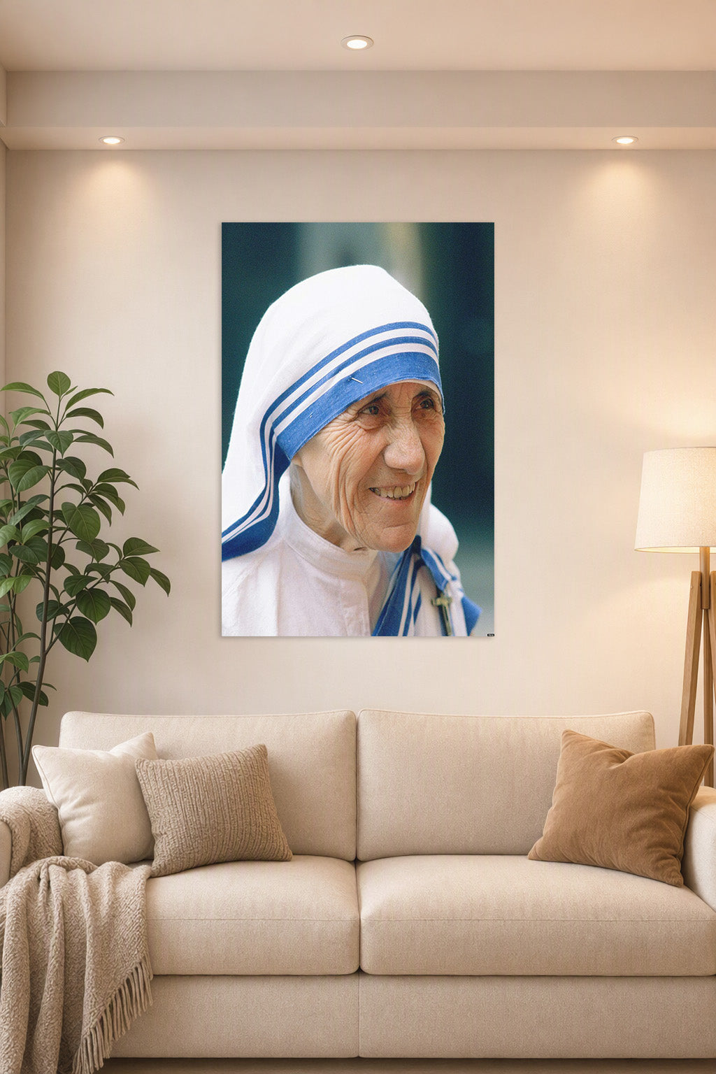 Mother Teresa in a bright living room above a beige sofa.