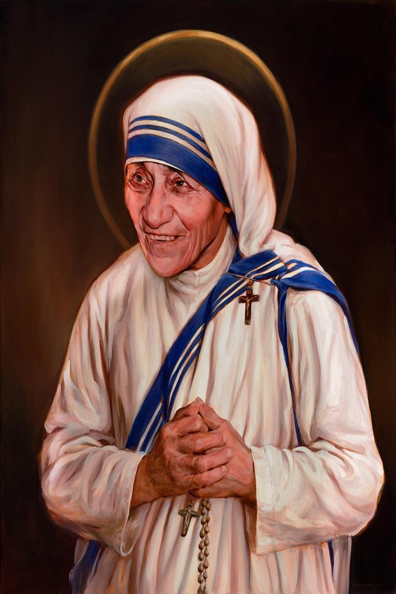 Mother Teresa wall art print portrays her smiling in a white and blue habit, clasping a rosary beneath a gold halo.