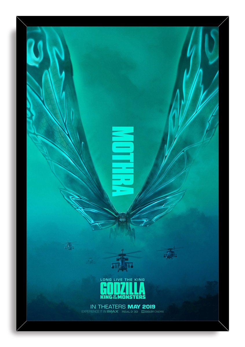 Mothra framed wall art print depicts the vast-winged creature hovering above helicopters in teal fog, bordered by a black frame.