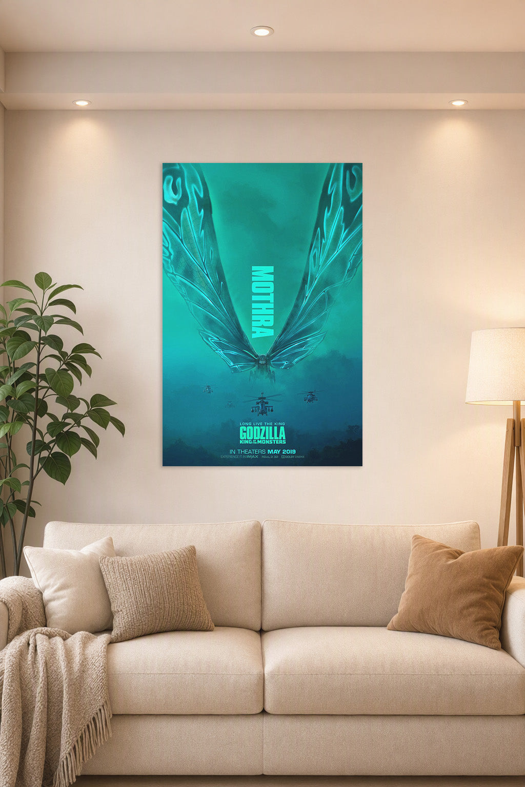 Mothra in a bright living room above a beige sofa.