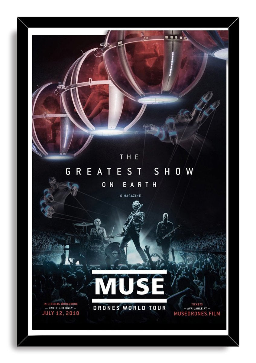 Muse Drones World Tour framed wall art print with musicians onstage, raised crowd hands, red aerial pods, and black frame.