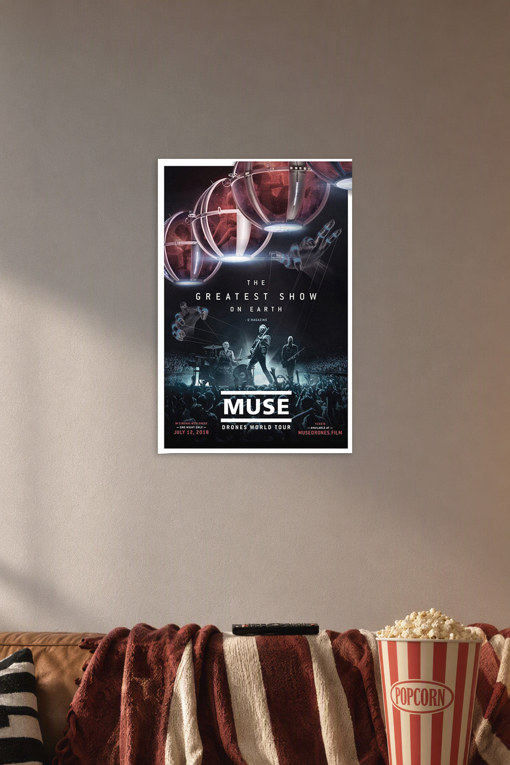 Muse Drones World Tour Concert in a cozy movie room above a brown sofa with popcorn.