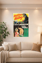 Mutiny on the Bounty Charles Laughton Clark Gable in a bright living room above a beige sofa.