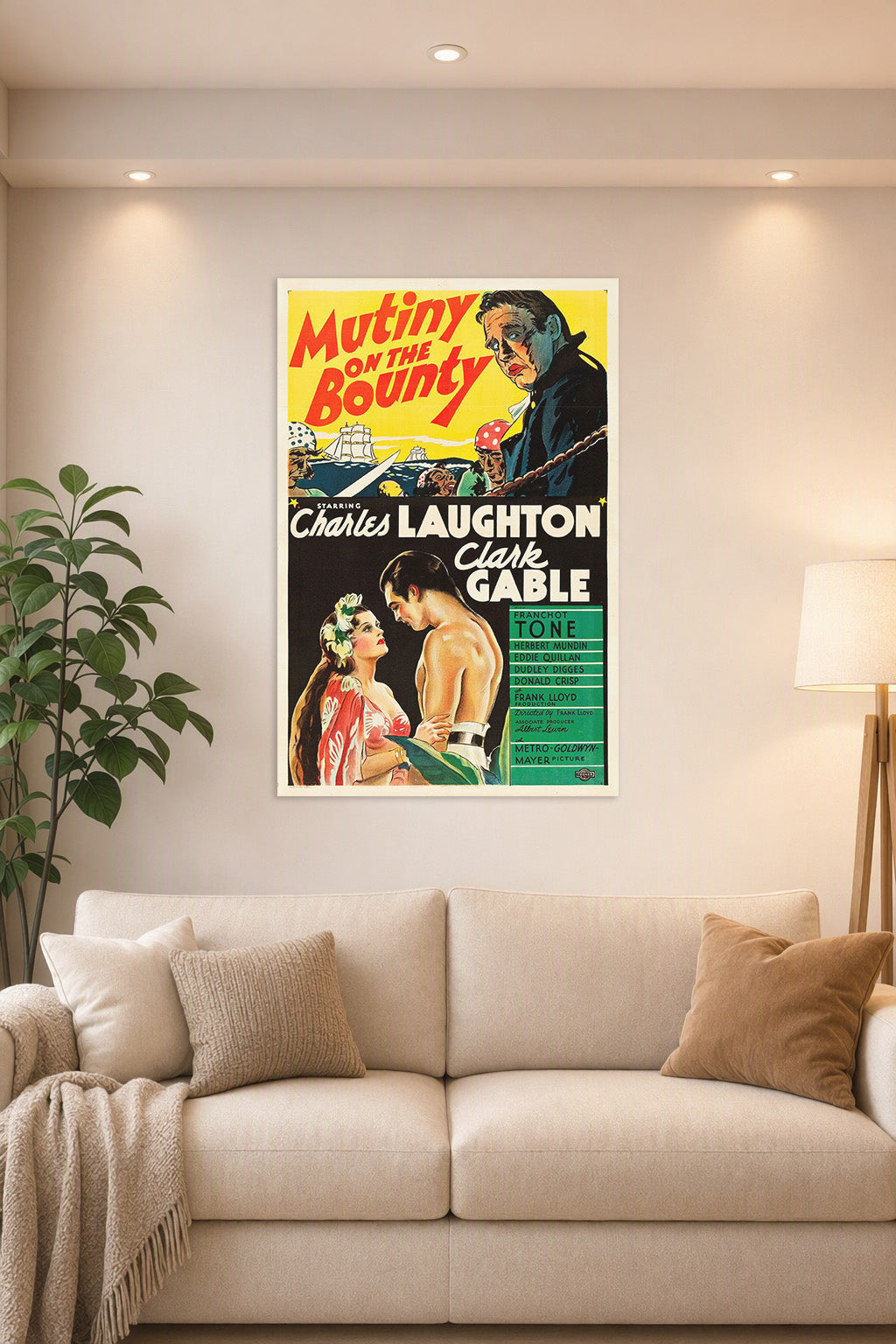 Mutiny on the Bounty Charles Laughton Clark Gable in a bright living room above a beige sofa.