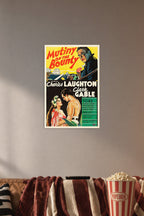 Mutiny on the Bounty Charles Laughton Clark Gable in a cozy movie room above a brown sofa with popcorn.