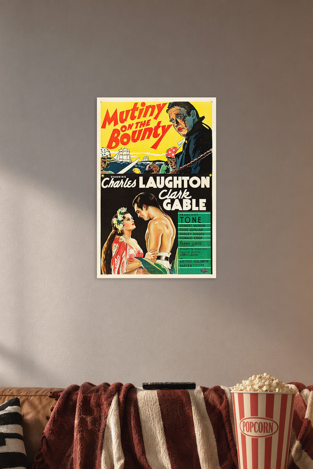 Mutiny on the Bounty Charles Laughton Clark Gable in a cozy movie room above a brown sofa with popcorn.