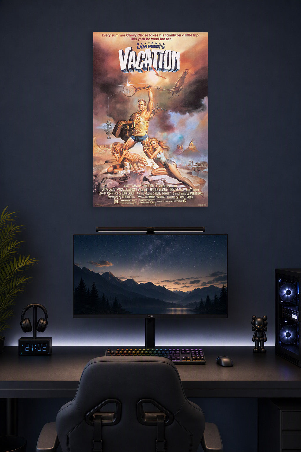 National Lampoon's Vacation Movie Poster in a gaming desk setup above a monitor.
