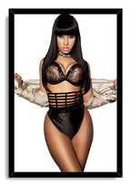 Nicki Minaj framed wall art print displays her posed in black lace lingerie, a crystal choker, and silver sleeves on white.