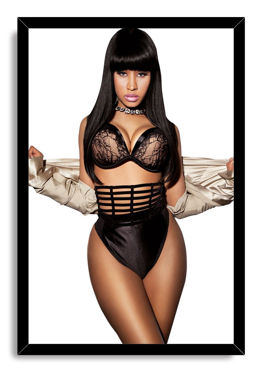 Nicki Minaj framed wall art print displays her posed in black lace lingerie, a crystal choker, and silver sleeves on white.