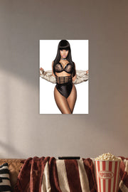 Nicki Minaj in a cozy movie room above a brown sofa with popcorn.