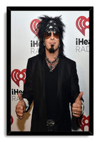 Nikki Sixx framed wall art print portrays the musician wearing a black bandana and sunglasses against a white iHeartRadio backdrop.