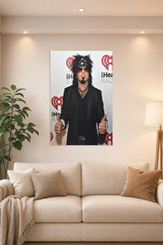 Nikki Sixx (Mötley Crüe) in a bright living room above a beige sofa.