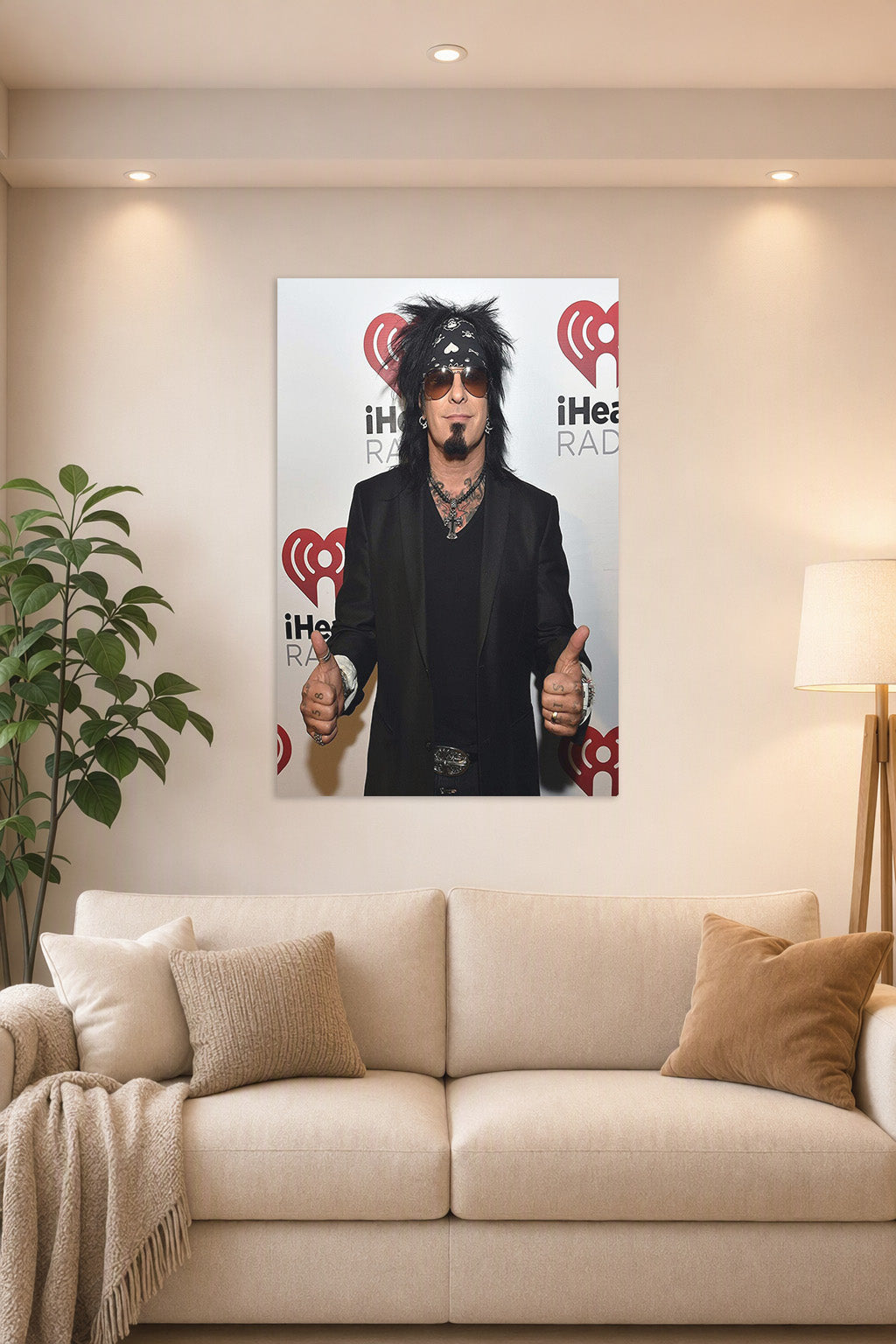 Nikki Sixx (Mötley Crüe) in a bright living room above a beige sofa.