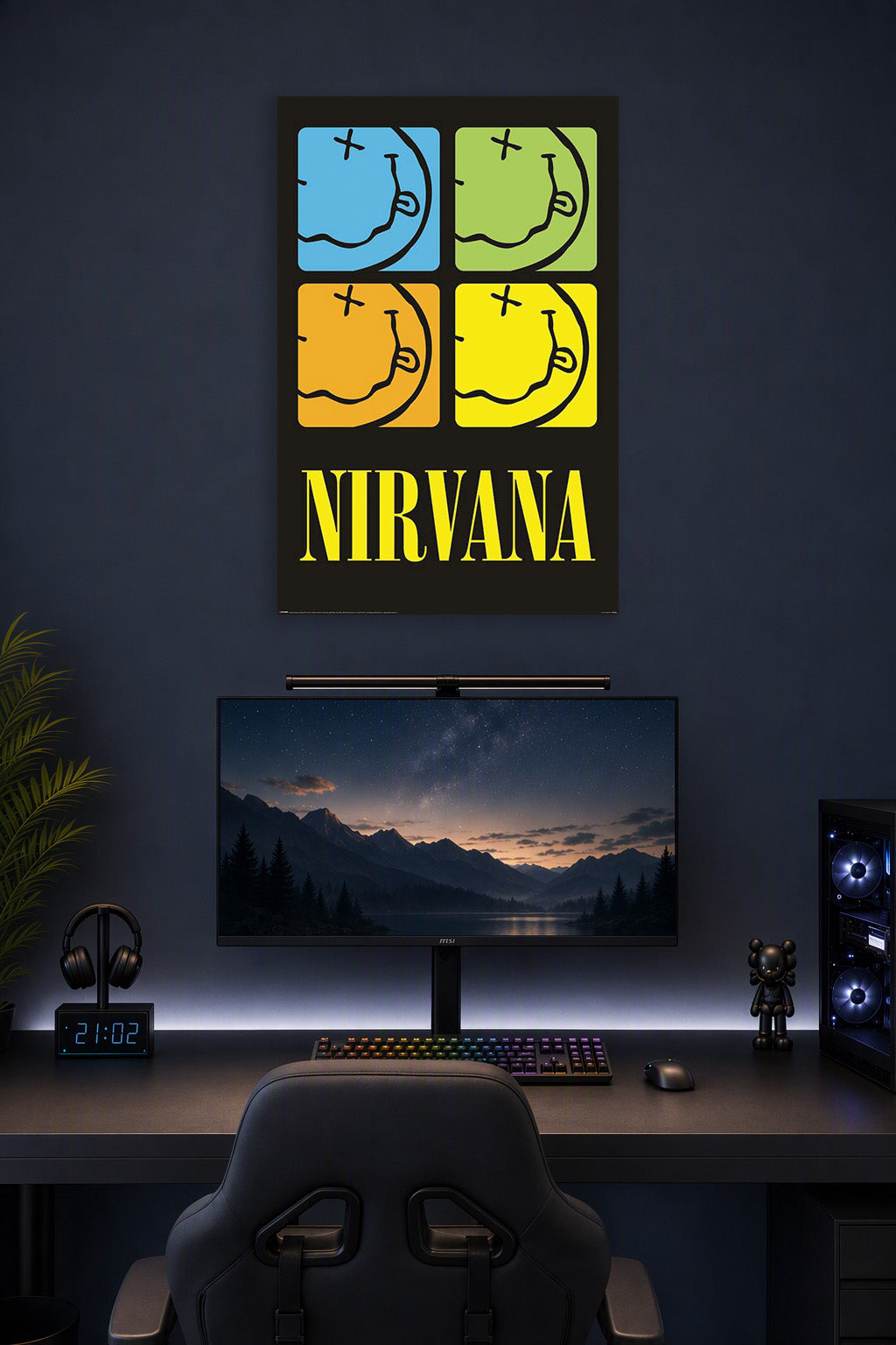 Nirvana-4 Colored Smileys - Logos Music in a gaming desk setup above a monitor.