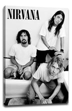 Nirvana canvas wall art presents a black-and-white portrait of three band members in a bathroom, with bold NIRVANA text at the top.