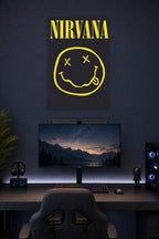 Nirvana Smiley Logo in a gaming desk setup above a monitor.