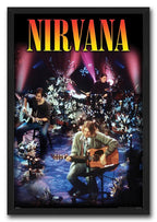 Nirvana framed wall art print portrays a flower-filled stage performance with acoustic guitar, bass, drums, and pink spotlights.