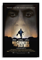 No Country for Old Men framed wall art print presents a man carrying a rifle beneath giant eyes in muted gold, gray, and black.