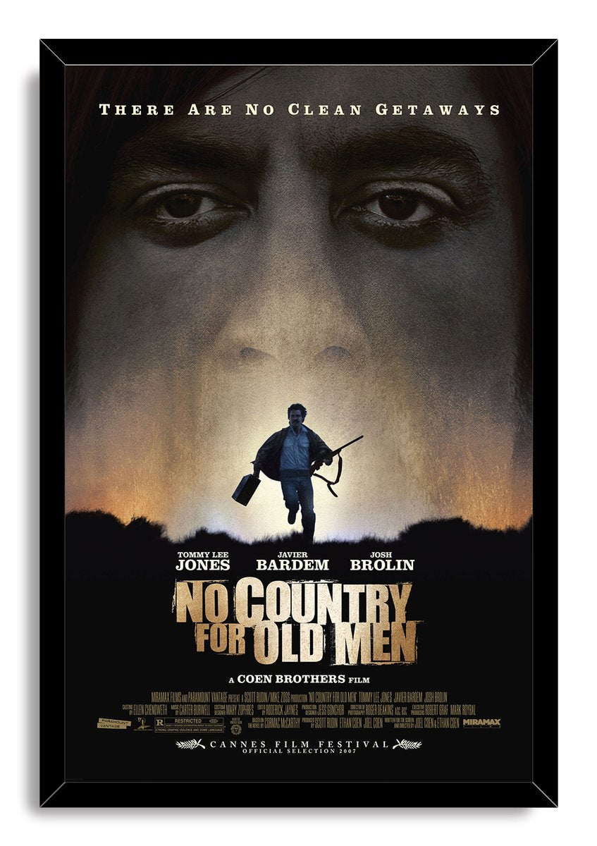 No Country for Old Men framed wall art print presents a man carrying a rifle beneath giant eyes in muted gold, gray, and black.