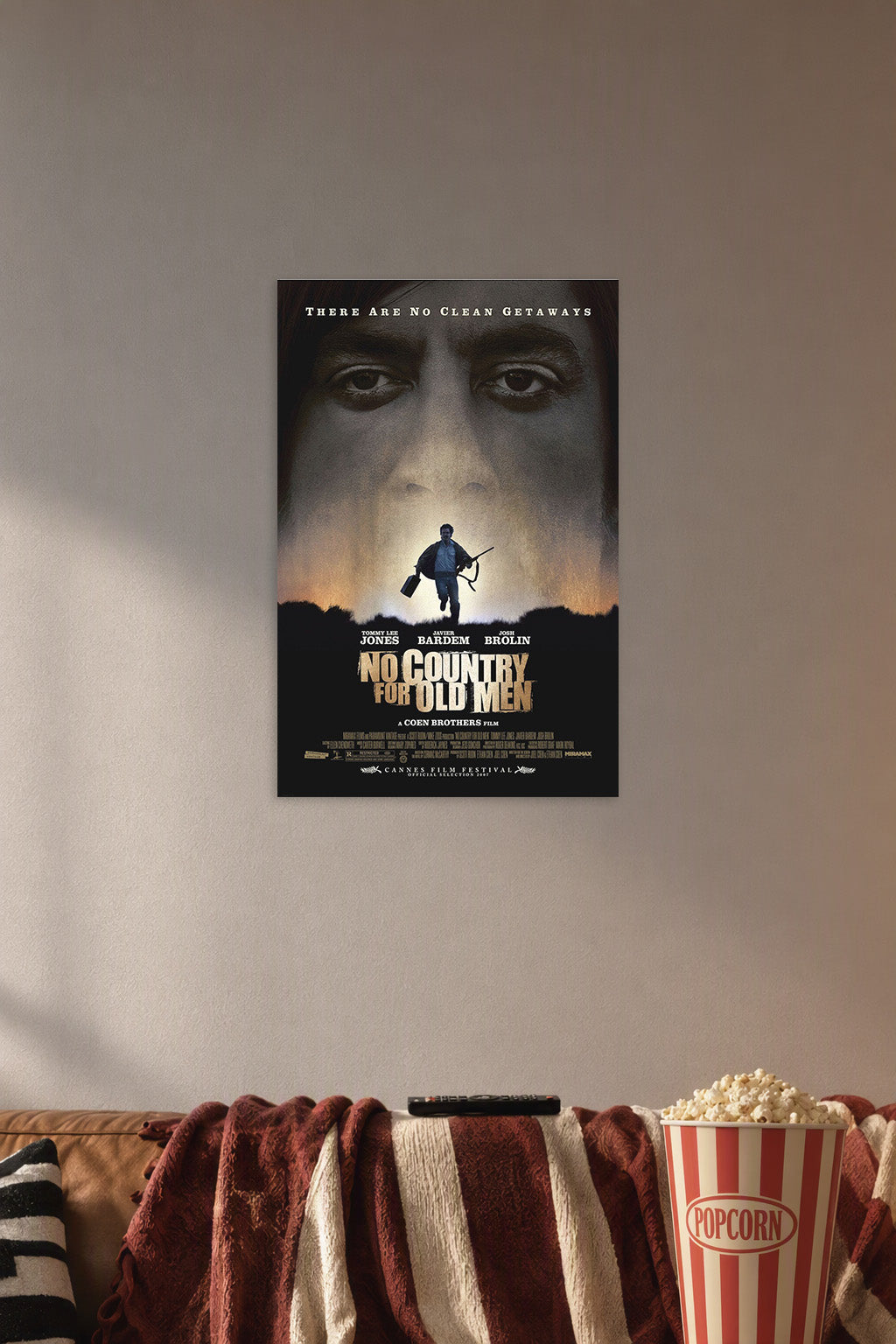 No Country For Old Men Movie in a cozy movie room above a brown sofa with popcorn.
