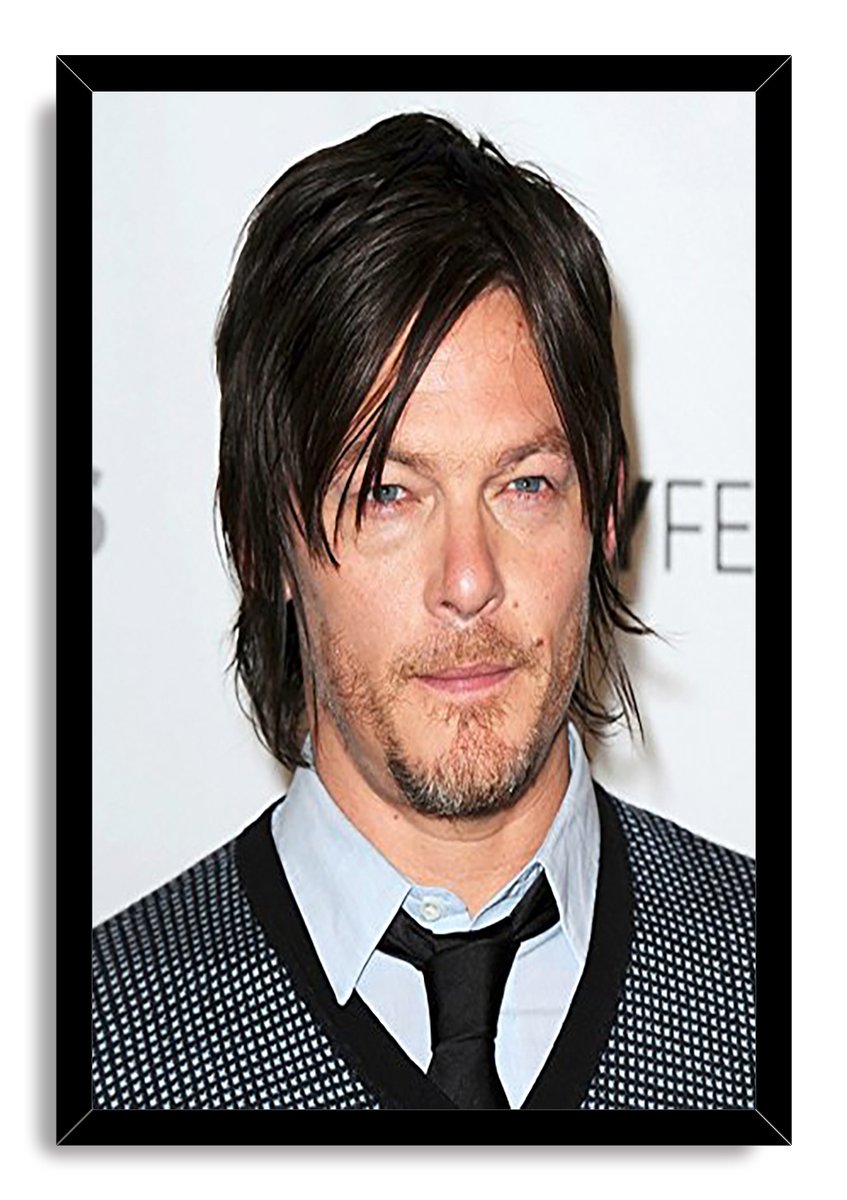 Norman Reedus framed wall art print with a black border around his close-up portrait against a pale event backdrop.