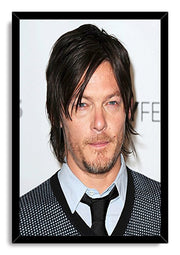 Norman Reedus framed wall art print with a black border around his close-up portrait against a pale event backdrop.
