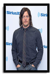 Norman Reedus framed wall art print presents a portrait in denim-blue clothing and tie, bordered by a black frame.