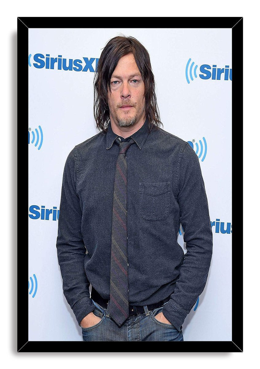 Norman Reedus framed wall art print presents a portrait in denim-blue clothing and tie, bordered by a black frame.