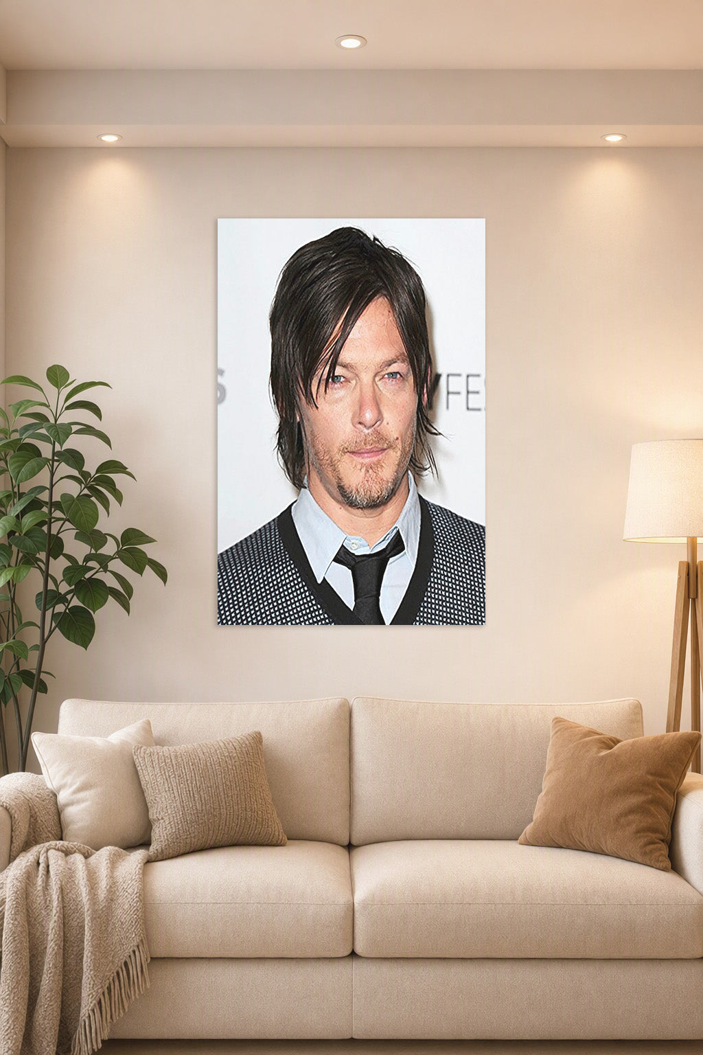 Norman Reedus in a bright living room above a beige sofa.