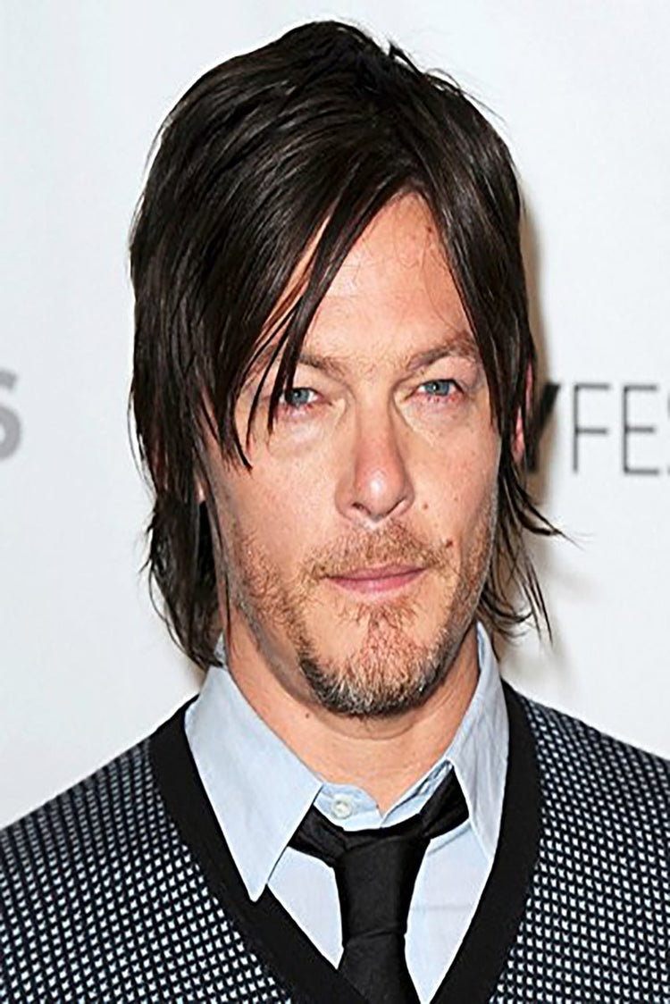 Norman Reedus poster portrait with dark layered hair, blue eyes, light shirt, black tie, and patterned jacket.