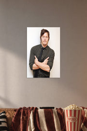 Norman Reedus in a cozy movie room above a brown sofa with popcorn.