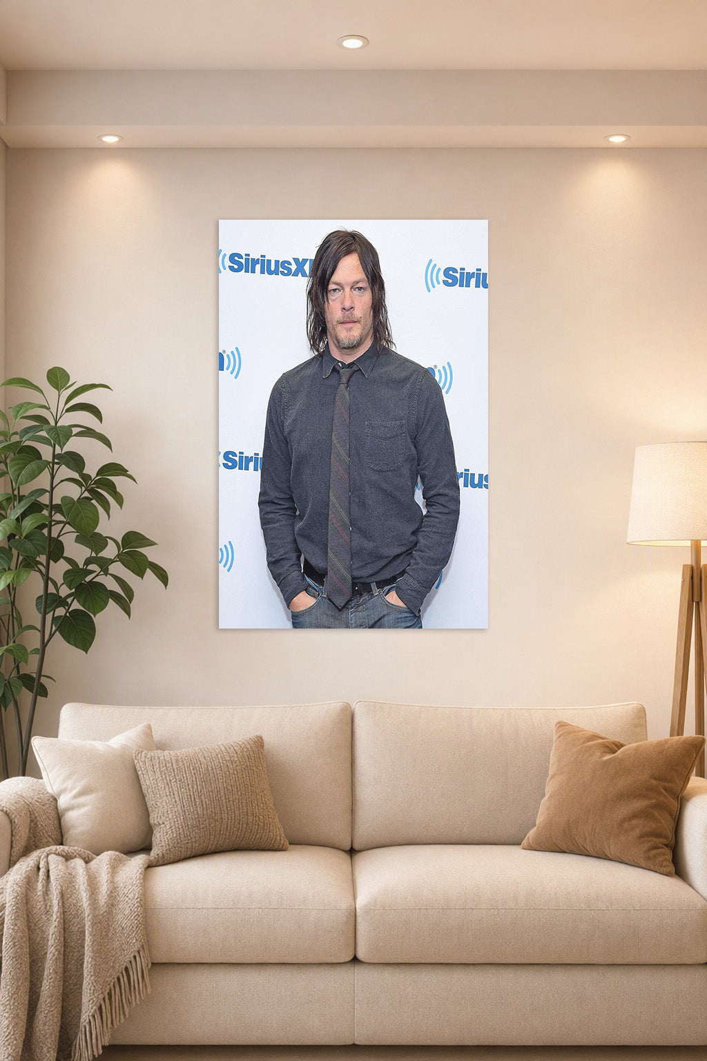 Norman Reedus in a bright living room above a beige sofa.