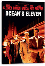 Ocean's Eleven wall art print on stretched canvas displays suited cast members, red actor names, and blurred orange night lights.