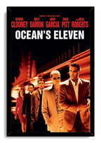 Ocean's Eleven framed wall art print featuring five formally dressed characters, red cast names, and bright orange motion trails.