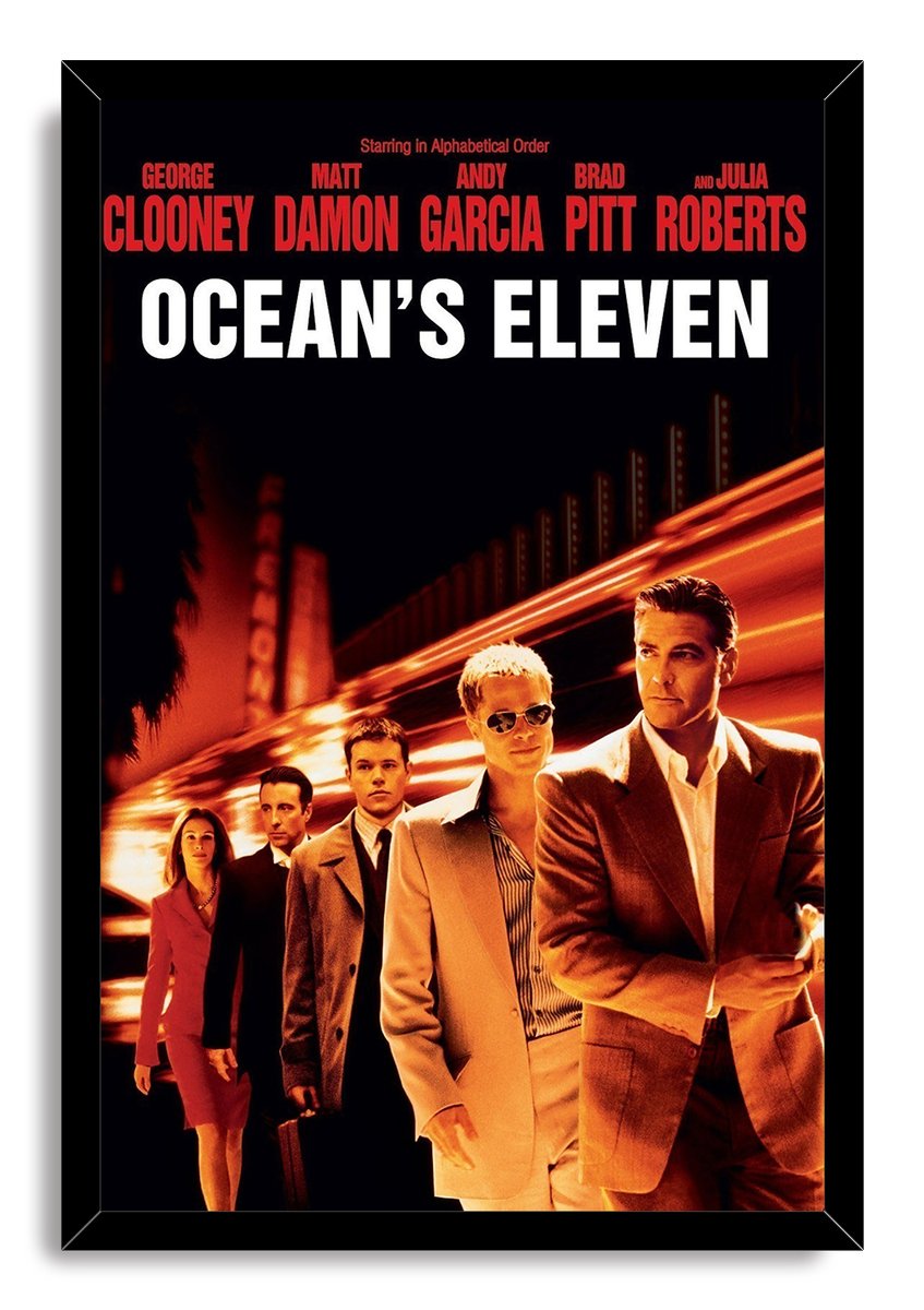 Ocean's Eleven framed wall art print presents five suited figures under red cast credits, white title lettering, and streaking amber lights.