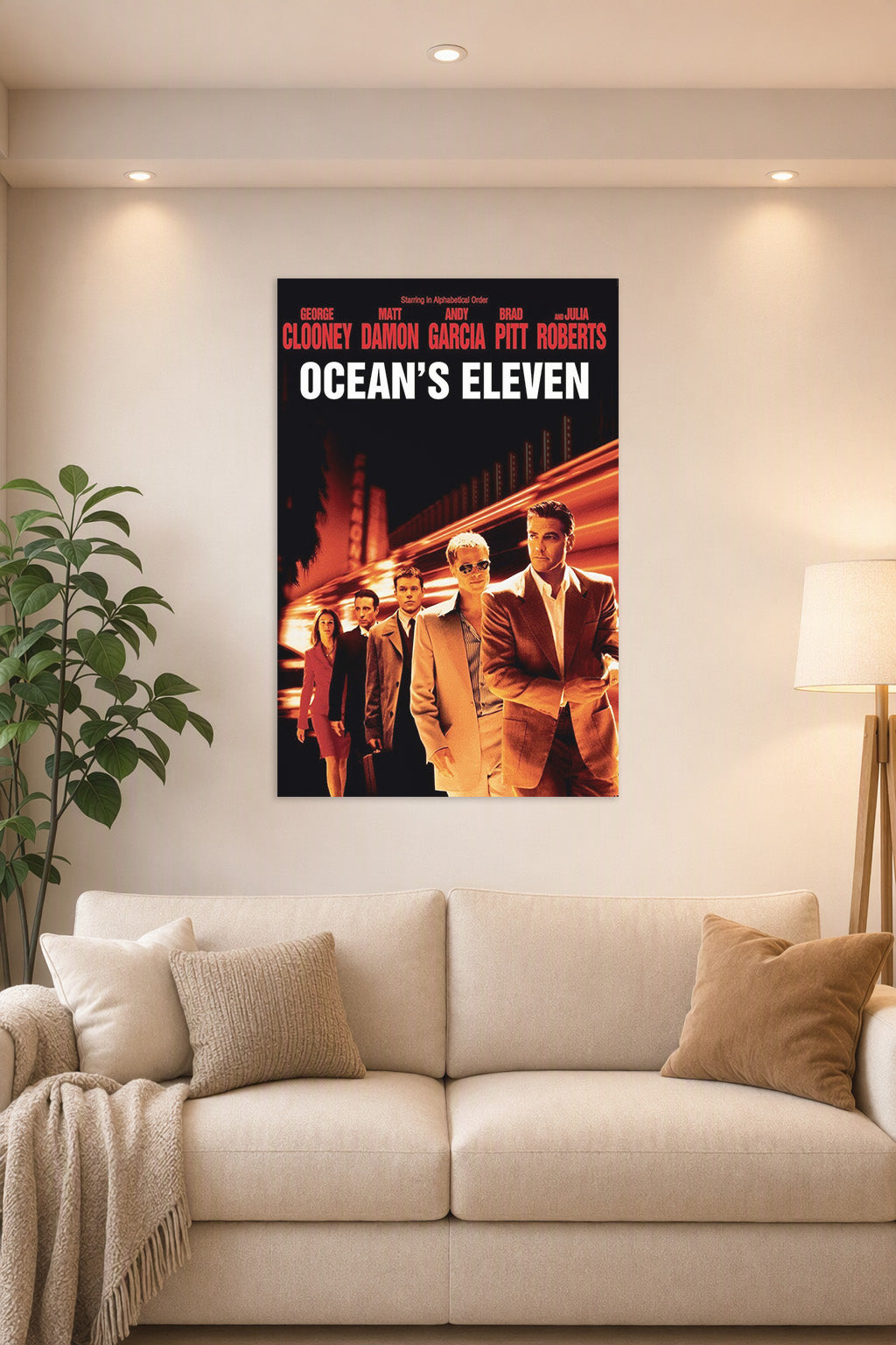 Ocean's Eleven Movie Poster in a bright living room above a beige sofa.