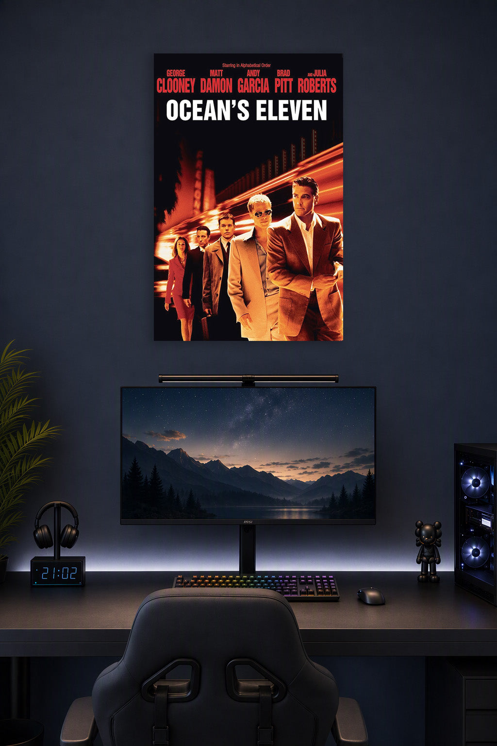 Ocean's Eleven Movie Poster in a gaming desk setup above a monitor.