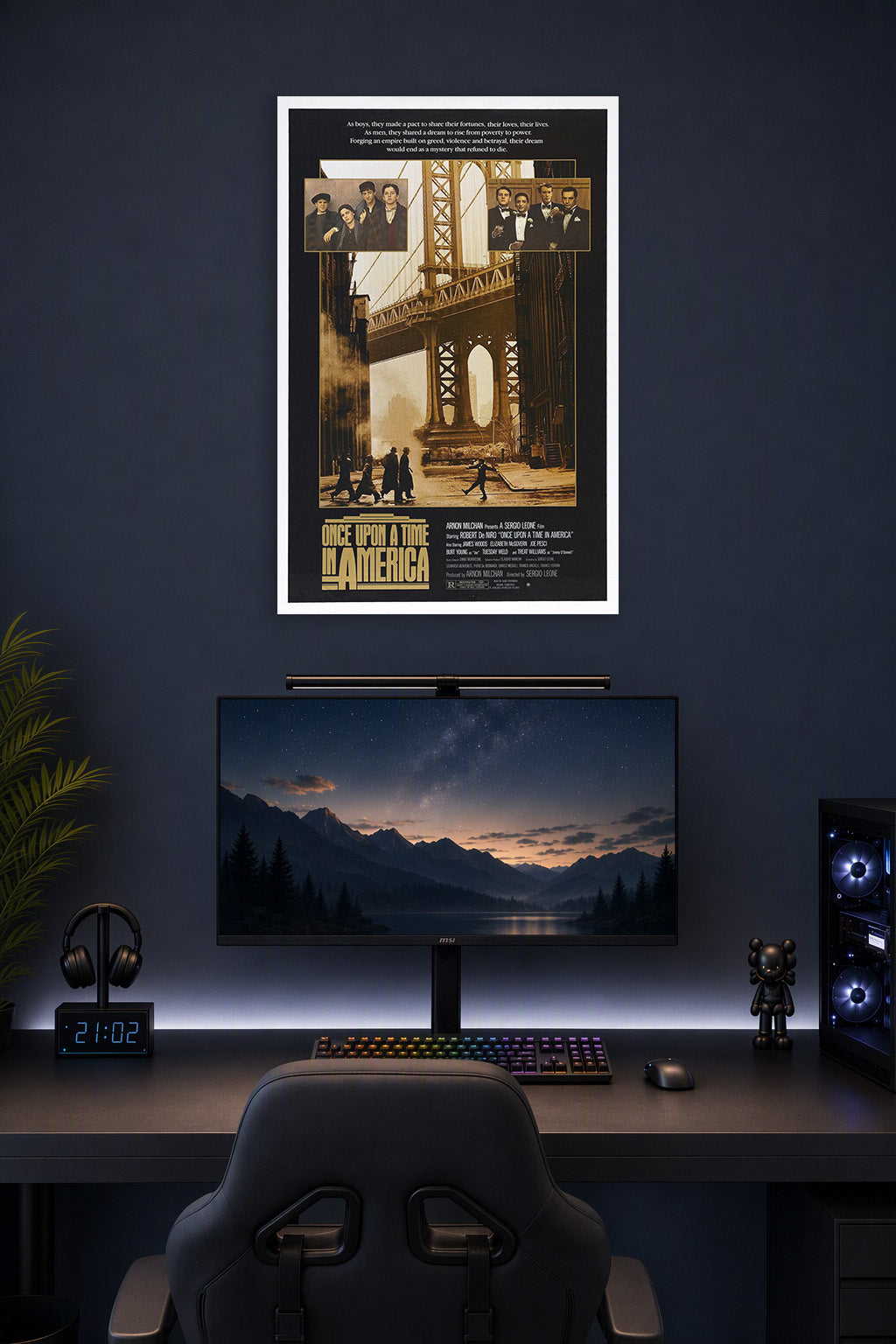 Once Upon a Time in America Movie Poster in a gaming desk setup above a monitor.