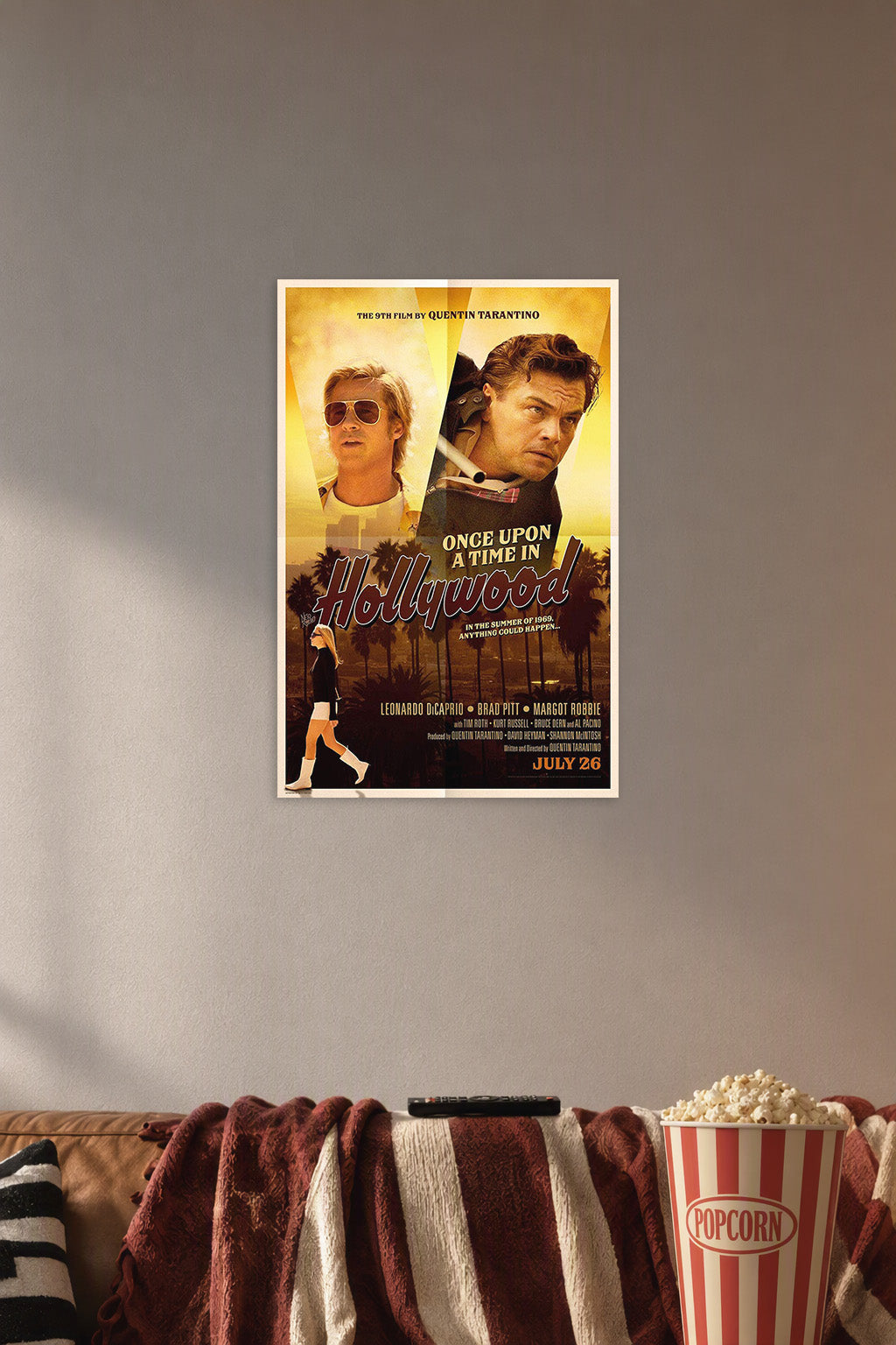 Once Upon a Time in Hollywood in a cozy movie room above a brown sofa with popcorn.