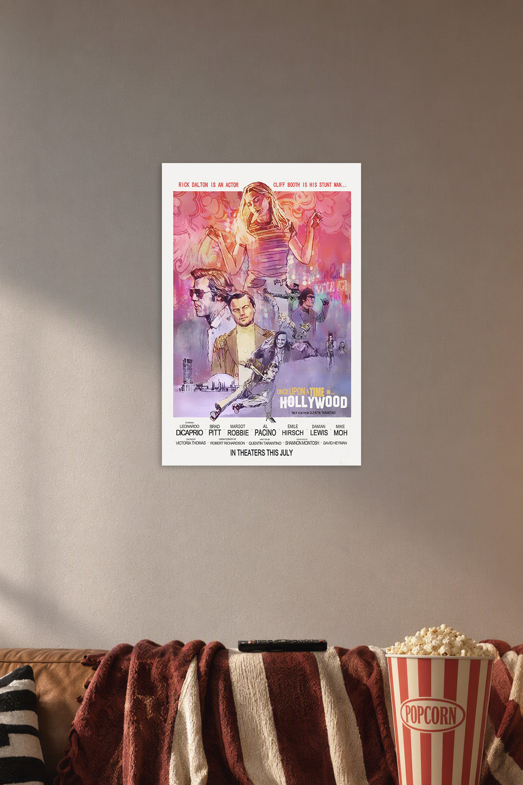 Once Upon a Time in Hollywood Movie Poster in a cozy movie room above a brown sofa with popcorn.