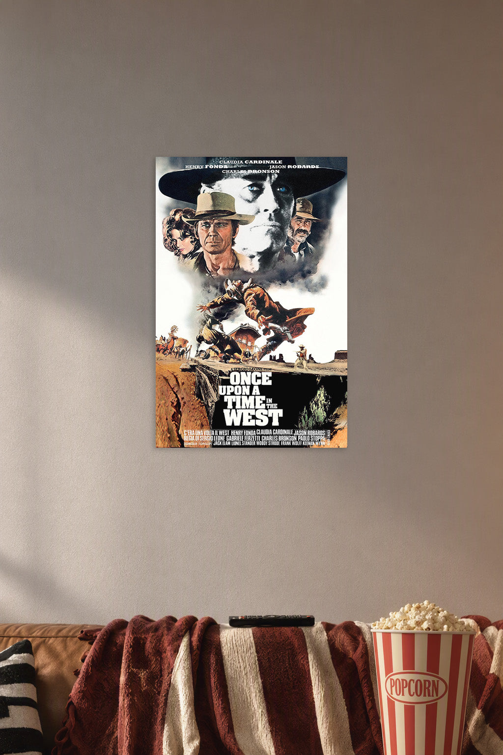Once Upon a Time in the West Movie Poster in a cozy movie room above a brown sofa with popcorn.