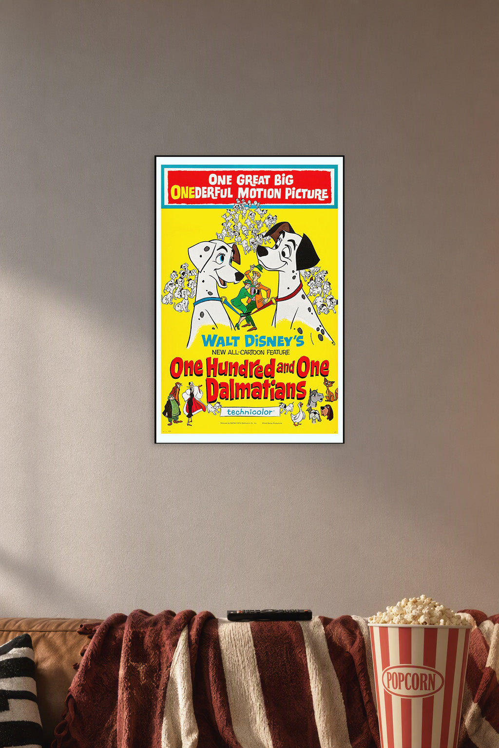 One Hundred and One Dalmatians in a cozy movie room above a brown sofa with popcorn.