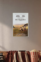 Out Of Africa Robert Redford Meryl Streep in a cozy movie room above a brown sofa with popcorn.