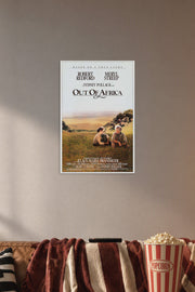 Out Of Africa Robert Redford Meryl Streep in a cozy movie room above a brown sofa with popcorn.
